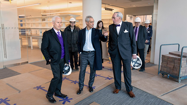 University president Morton Schapiro, Chicago Mayor Rahm Emanuel and dean of Feinberg School of Medicine Dr. Eric Neilson tour the Simpson Querrey Biomedical Research Center in January. The center is set to open in June.