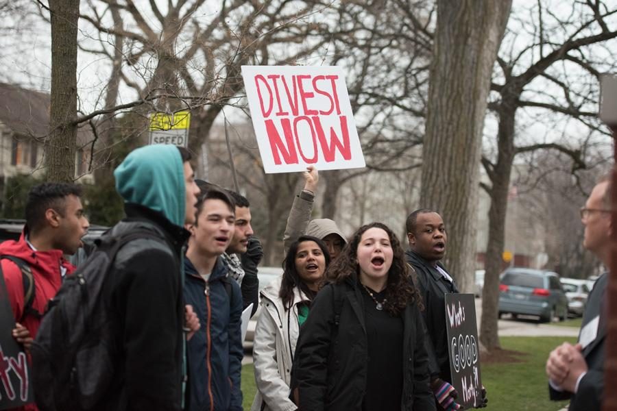 Student activists gather outside University President Morton Schapiros house in April 2016. Northwestern’s chapter of Students for Justice in Palestine is renewing its for divestment. 