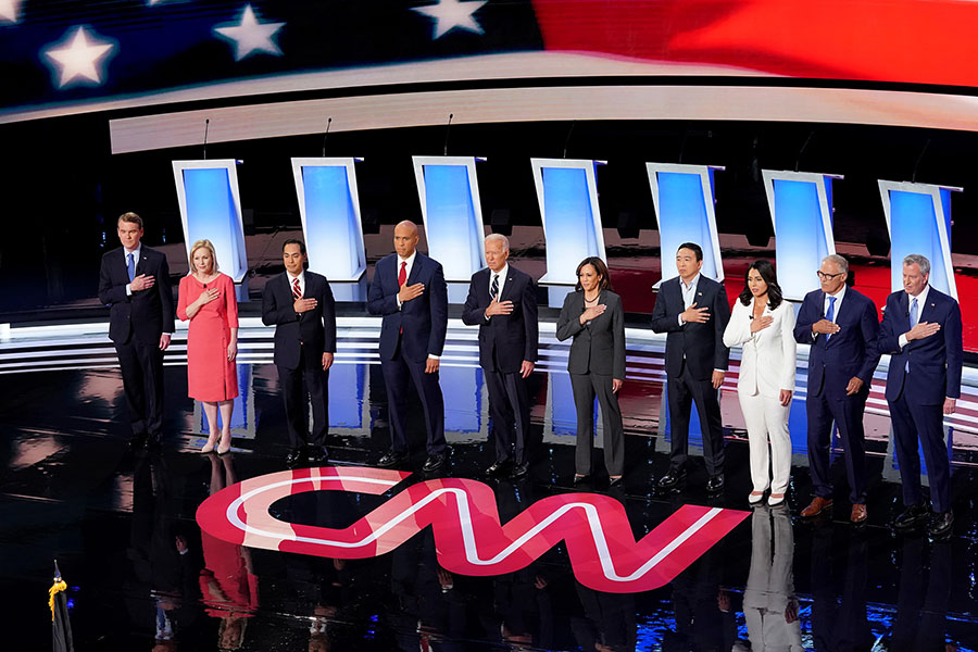 Candidates+listen+as+the+national+anthem+plays+before+the+second+night+of+debates+in+Detroit.+The+presidential+hopefuls+discussed+a+range+of+issues+like+healthcare%2C+race+and+climate+change.