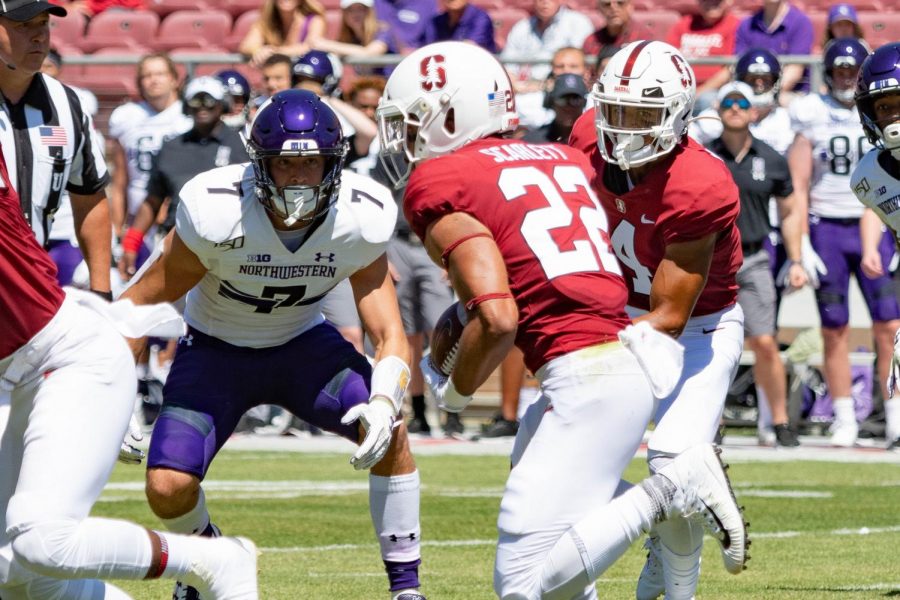 Travis Whillock stares down a Stanford running back. Whillock tied for the team lead with 10 tackles.