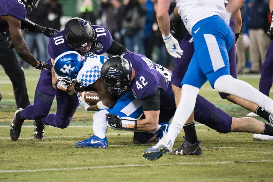 Paddy Fisher makes a tackle. The junior linebacker is NU’s lone returning captain this season.