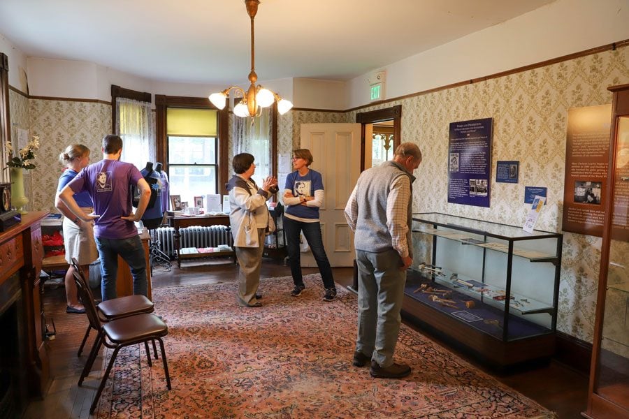 Visitors to the Frances Willard House Museum speak with museum staff. On Sunday, the museum hosted an open house to commemorate the social leader’s 180th birthday.