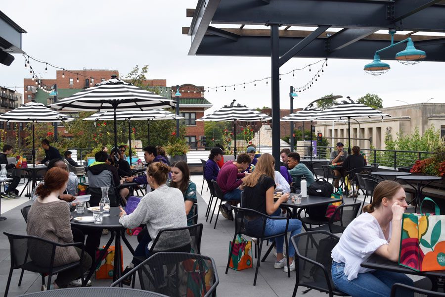 Students and residents enjoy free samples on That’s Five and Dime’s rooftop terrace.
