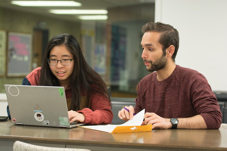 Andrea Lin and Khizar Nandoliya edit essays in Norris. The two Northside College Prep alumnae created an editing service for CPS seniors affected by the strike.