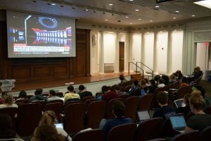 Students watch the Democratic Presidential Debate at Harris Hall. The watch party was hosted by Associated Student Government, Political Union and College Democrats.