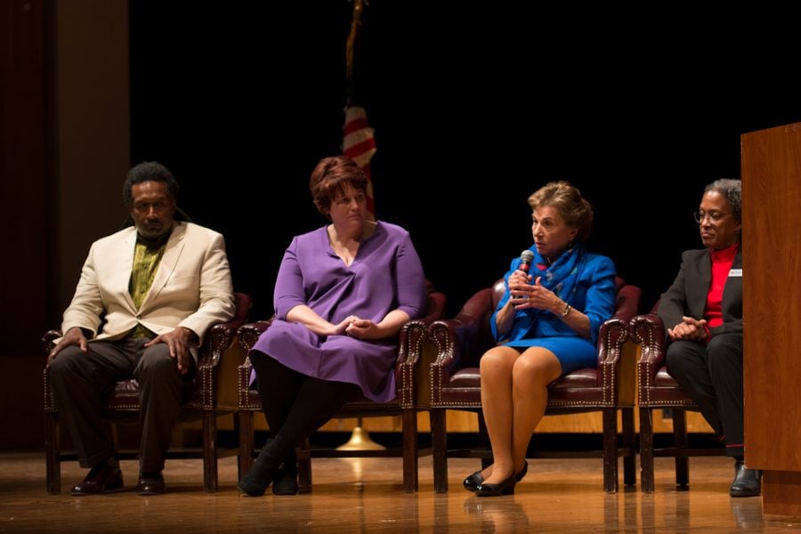 Four speakers address a crowd during a Q&A. The event, hosted by the Democratic Party of Evanston, focused on hate speech in the United States.