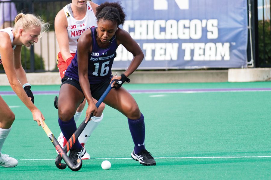 Junior Midfielder Christen Conley battles for the ball against No. 2 Maryland. The Wildcats have a big game this weekend against Iowa.