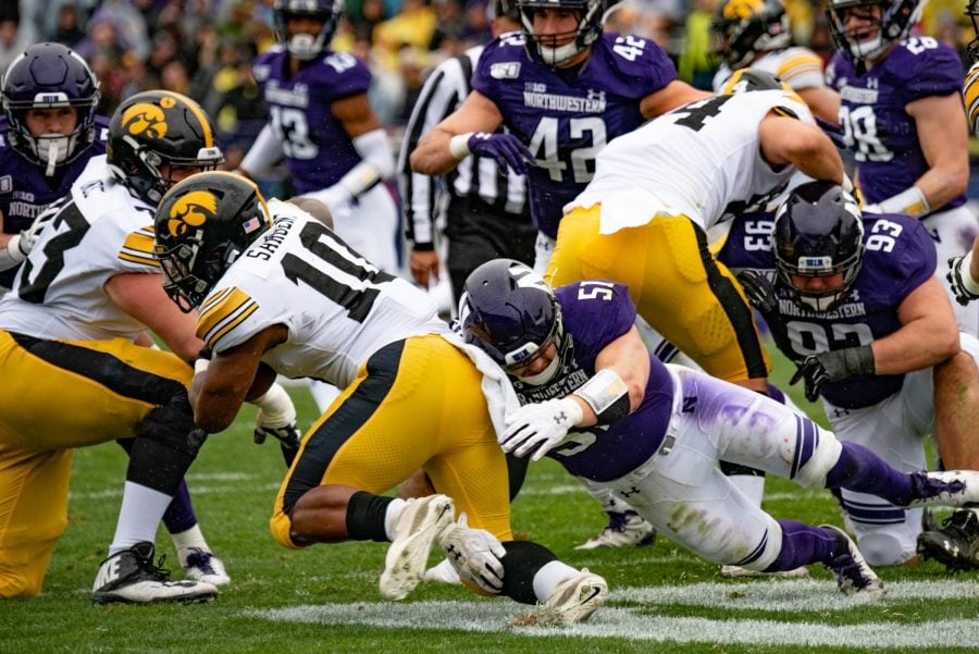 Blake Gallagher makes a tackle on an Iowa runner. The junior linebacker led the team with 10 tackles. 
