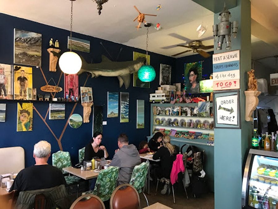 Customers eat Sunday brunch at Prairie Joe’s. The retro neighborhood diner is also a gallery for owner Aydin Dincer’s paintings.