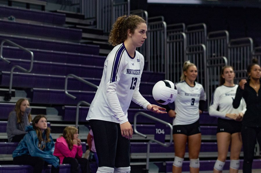 Olivia Viscuso prepares to serve the ball. The senior middle blocker is second on the team with eight service aces. 