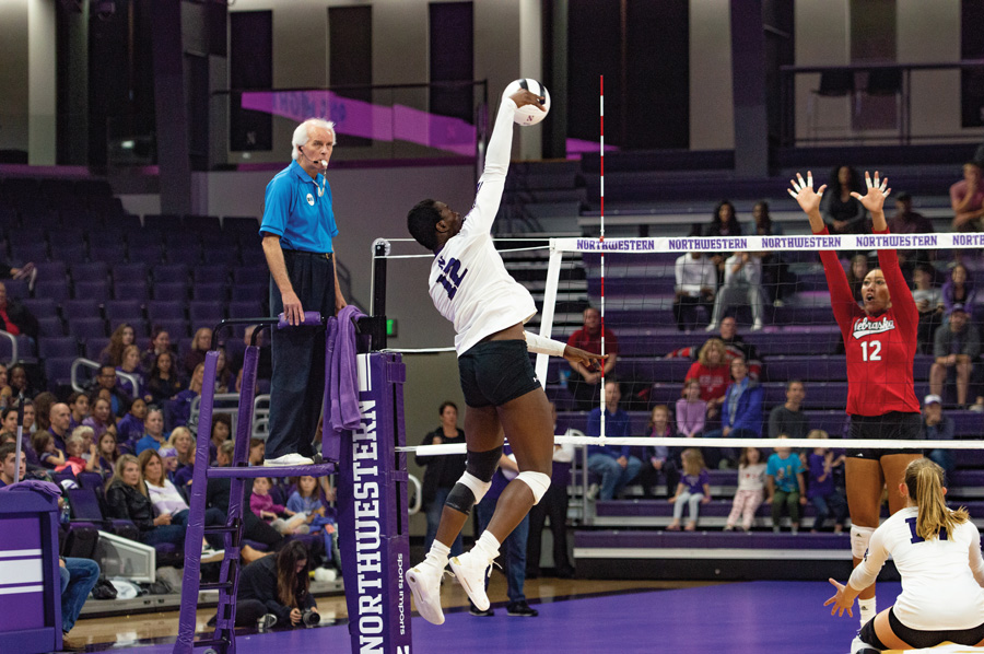 Temi+Thomas-Ailara+jumps+to+hit+the+ball.+The+freshman+outside+hitter+might+not+play+in+the+Cats%E2%80%99+game+on+Friday.+