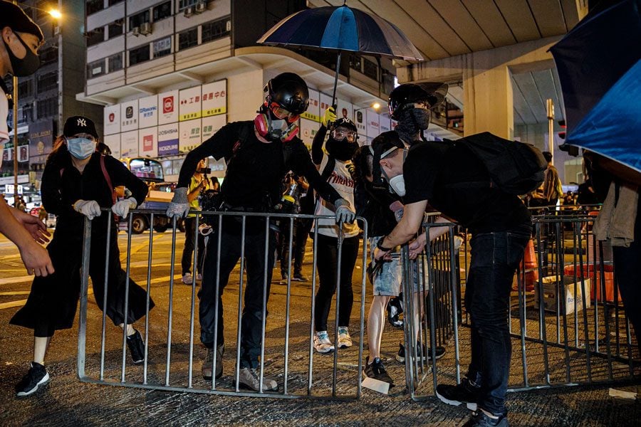 Protesters set up roadblocks outside the Mong Kok police station in Hong Kong, on September 8, 2019.