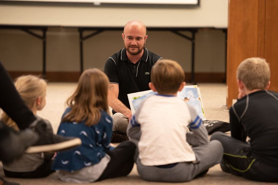 Kyle Lukoff reads to children at Evanston Public Library. One of Lukoff’s stories, “When Aidan Became a Brother,” explores transgender identity and the feeling of having a new sibling.