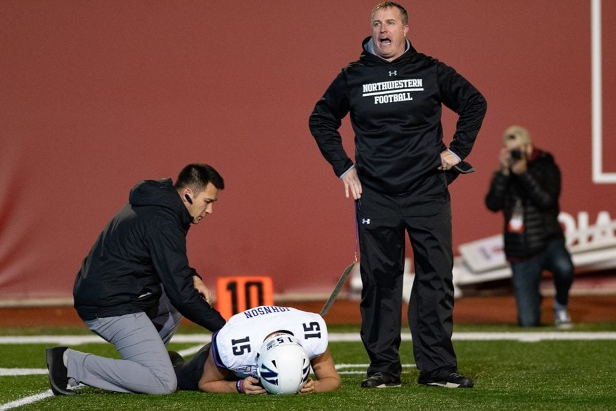 Coach Pat Fitzgerald yells after Hunter Johnson was injured in the third quarter. Johnson did not return to the game.