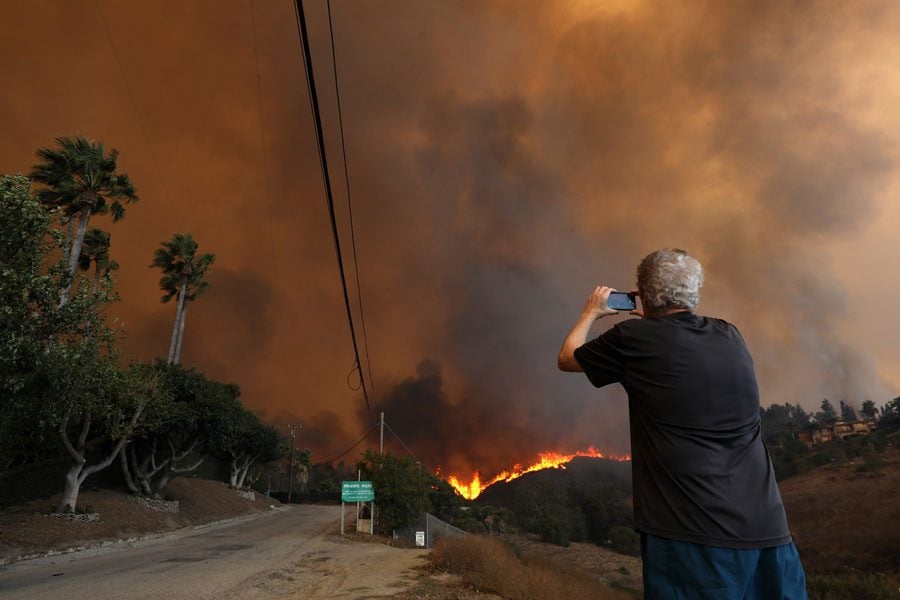 A resident shoots video of the Woolsey fire that threatens homes along West Winding Way in Los Angeles Malibu on November 9, 2018. 