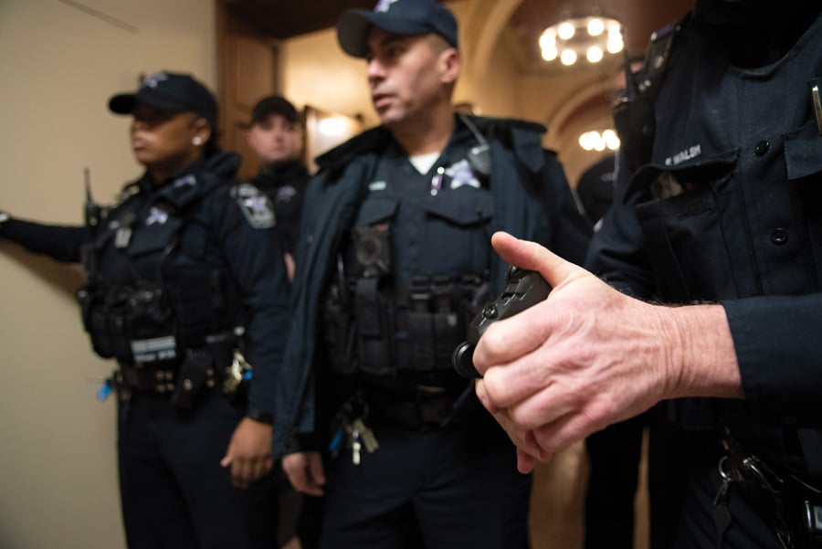 University Police officers formed a shoulder-to-shoulder wall blocking the Lutkin Hall foyer amid protests against former Attorney General Jeff Sessions.