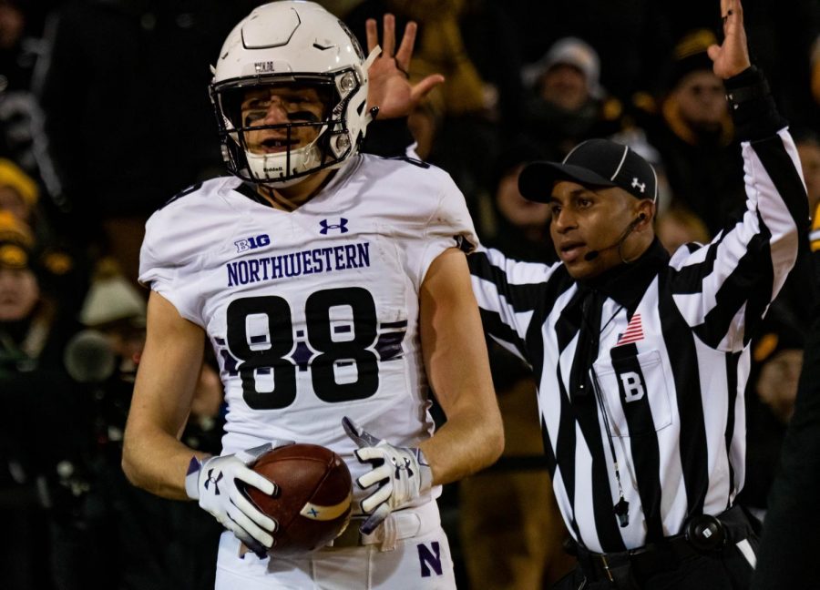 Bennett Skowronek scores a touchdown against Iowa. His catch in 2018 propelled the Cats to clinching the Big Ten West. 