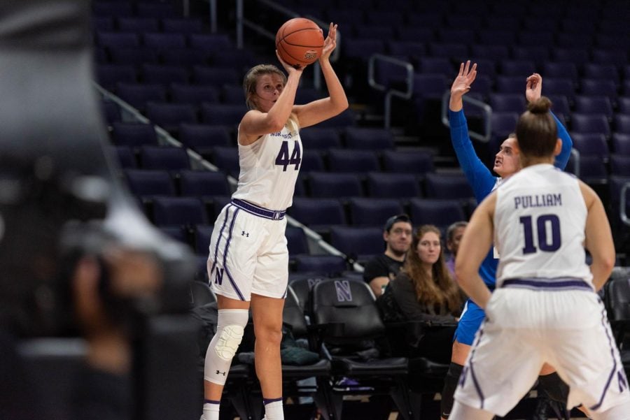 Abi Scheid shoots a three. Northwestern has risen to the top of the Big Ten standings this season.