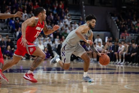 Boo Buie makes a move. NU lost 77-73 to Rutgers in overtime.