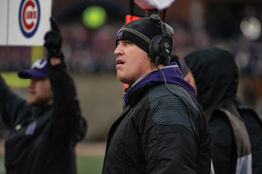 Pat Fitzgerald looks at the replay screen. The head coach heads into the 2020 season one win away from 100 career wins at Northwestern.