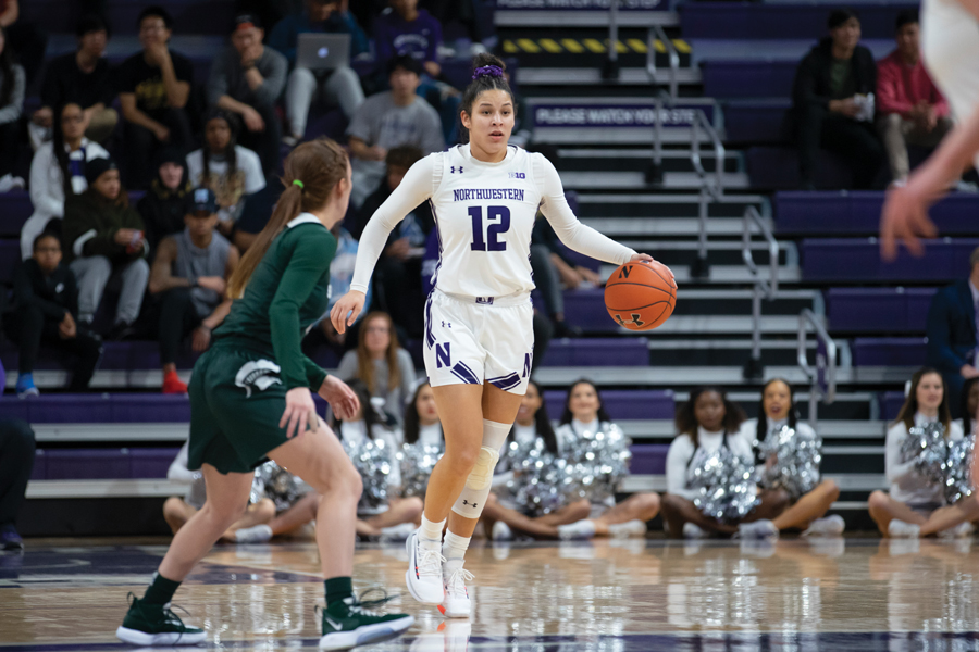 Veronica Burton moves the ball down the court. The sophomore guard finished with 23 points in NU’s win over Michigan State.