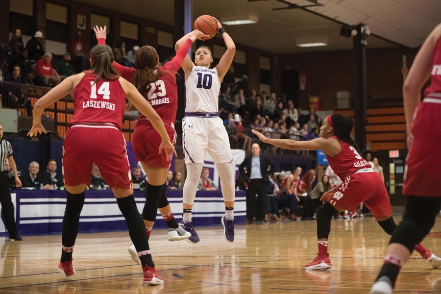 Lindsey Pulliam takes a shot during a 2018 game. The Wildcats played the 2017-18 season at Evanston Township High School while Welsh-Ryan Arena was under renovation.