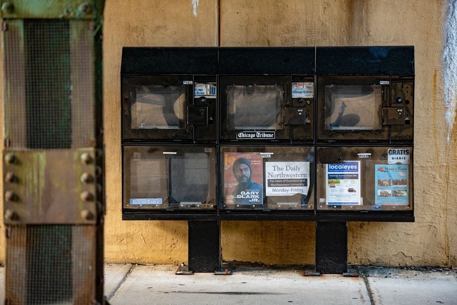 A newspaper vending machine under an L bridge in downtown Evanston. Local newspapers have reported an increase in readership since Illinois’s COVID-19 stay-at-home order was put in place.
