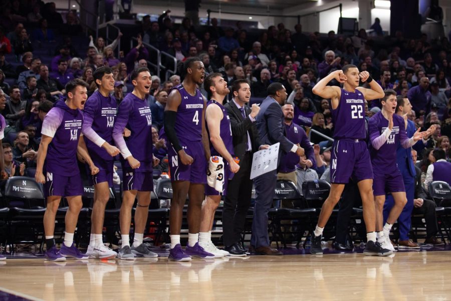 Chris Collins and Northwestern’s coaches watch from the sidelines. Saturday night, they received a commitment from a top-100 forward, Casey Simmons.
