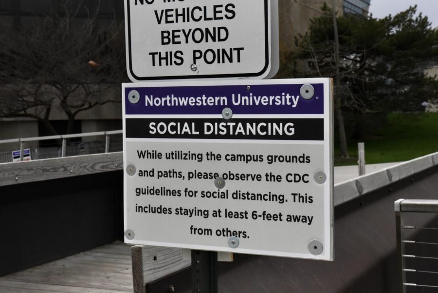 A social distancing sign posted by the Lakefill. The University hosted a webinar Thursday on expectations for the student experience this fall.