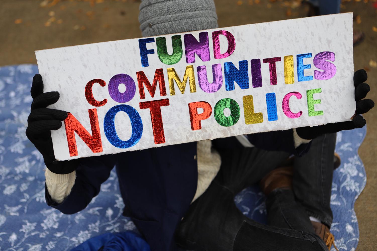 A+sign+from+a+previous+NU+Community+Not+Cops+demonstration%2C+reading+%E2%80%9CFund+Communities+Not+Police.%E2%80%9D+Students+reimagined+justice+in+a+Wednesday+discussion+led+by+FMO+and+NUCNC.