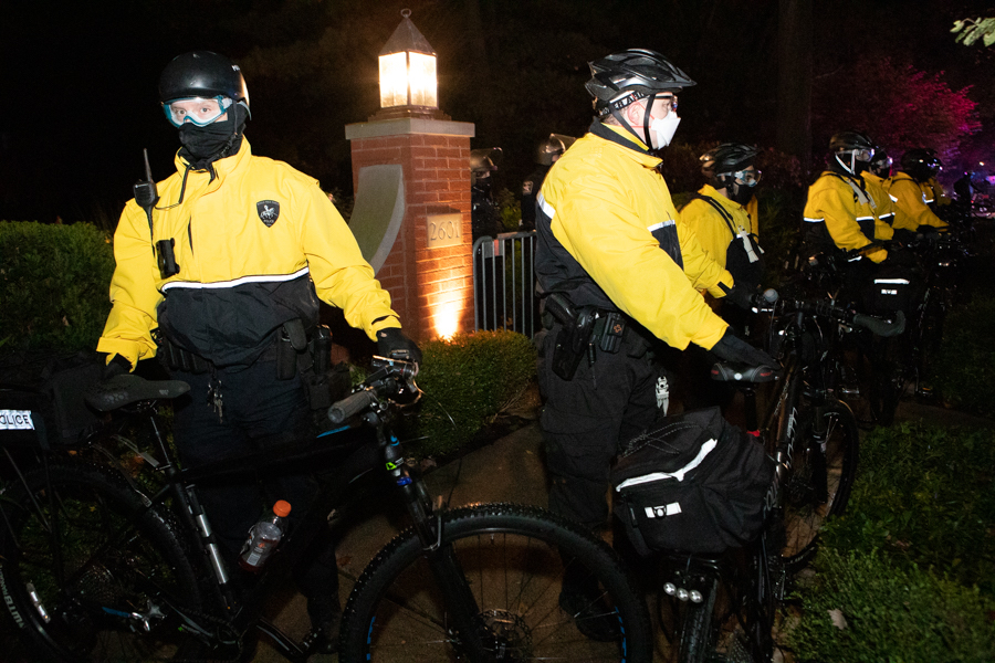 Officers from the Northern Illinois Police Alarm System’s Mobile Field Force guard President Schapiro’s home at a recent protest. Schapiro announced updates to the University’s racial justice commitments in a Tuesday email.