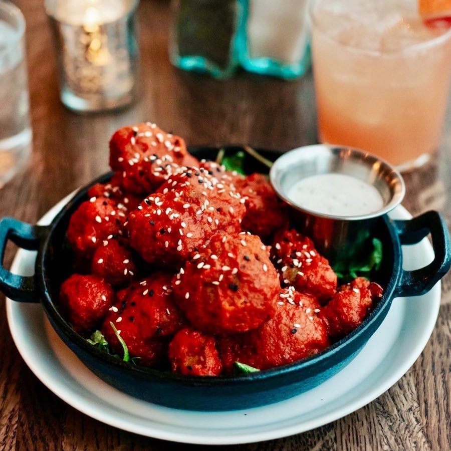  Spirit Elephant’s Cauli-Wings are served piping hot and doused in delectable buffalo sauce. They’re one of many dishes on the restaurant’s fully vegan menu.