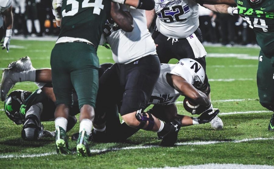 Cam Porter scores a touchdown. His was one of only two NU trips to the end zone against Michigan State.