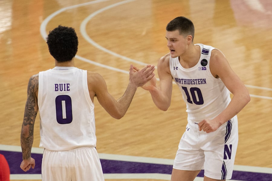Miller Kopp and Boo Buie high-five. Kopp’s 23 points and Buie’s late three-pointer propelled Northwestern to a 71-70 victory over No. 23 Ohio State on Saturday.
