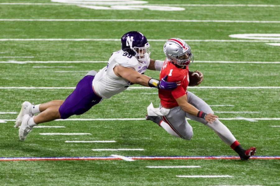 Earnest Brown pulls down Justin Fields. The Northwestern defense held Ohio State’s quarterback to a career-low 114 yards in the Big Ten Championship Game.