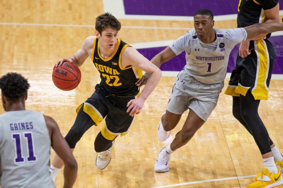 Sophomore guard Chase Audige defends an opponent in Northwestern’s home loss to Iowa. The Cats dropped their seventh straight contest on Saturday night.