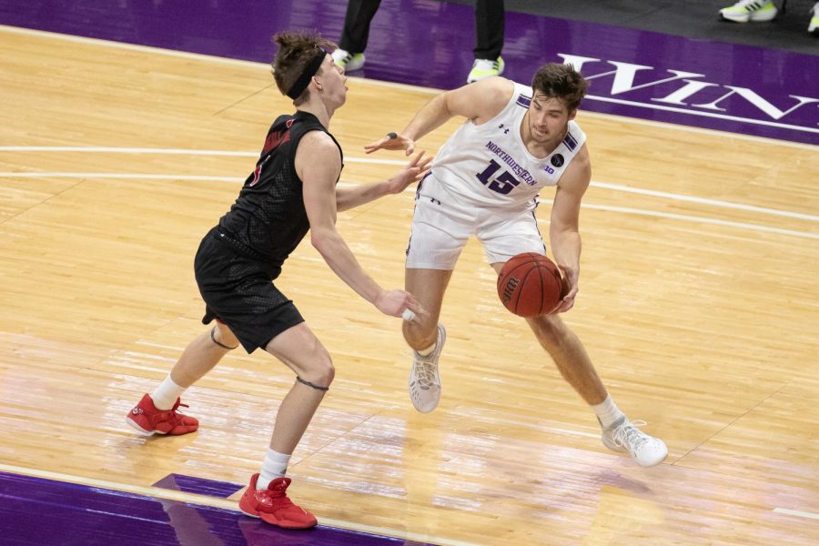Ryan+Young+backs+his+defender+down+during+Northwestern%E2%80%99s+loss+to+Rutgers+on+Jan.+31.+The+Cats+lost+their+10th+straight+game+in+a+double+overtime+loss+to+Indiana.+