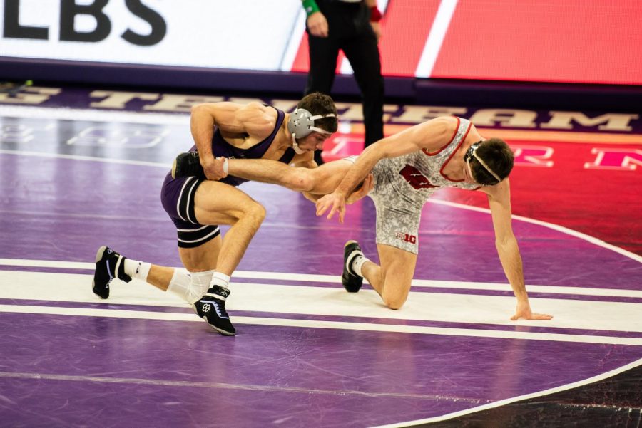 Two wrestlers on a mat