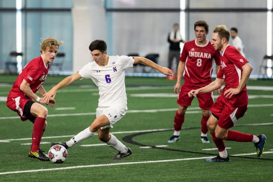 Vicente Castro fights for the ball. The sophomore midfielder scored a goal in Northwestern 4-2 loss to Ohio State.