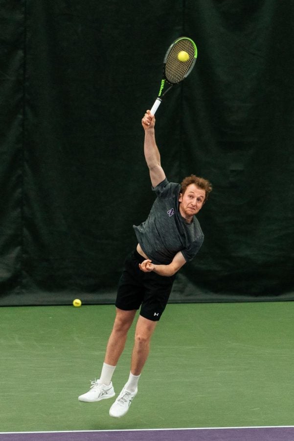 Male tennis player serving