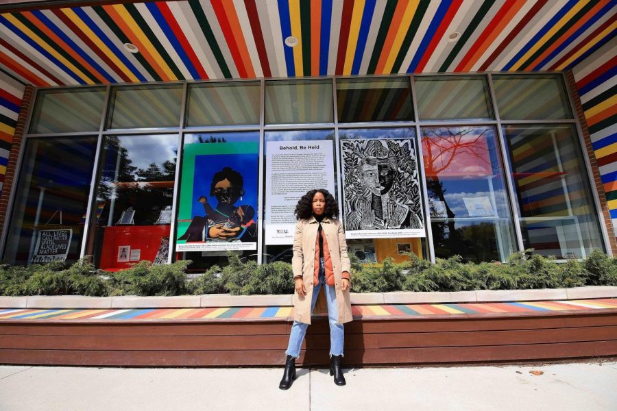 Curator Rikki Byrd stands outside the Youth & Opportunity United (YOU) building at 1911 Church Street. Students part of the YOU Leadership Project selected two works for the exhibition “Behold, Be Held.”