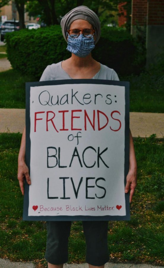 Mimi Holland, a member of Evanston Friends Meeting, holds up her sign supporting Black Lives Matter. Several other members of the Evanston Quaker congregation also attended the “Reclaim the Block” party. 