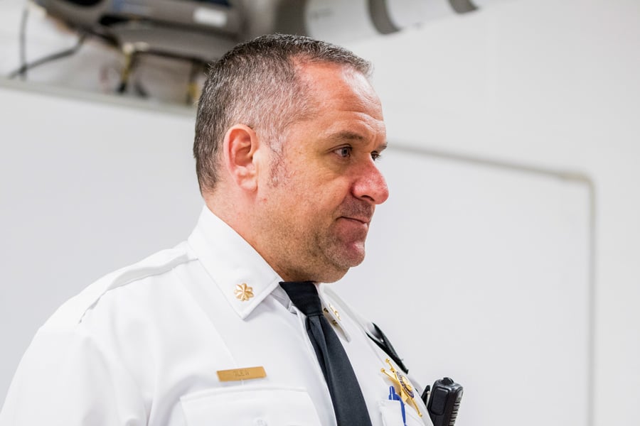 Evanston police Cmdr. Ryan Glew, a White man in a white police uniform