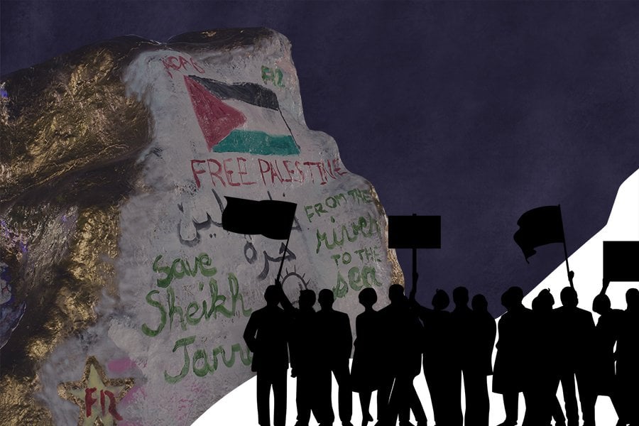The Rock, with gold siding and words “Free Palestine” among others. The background is dark blue with silhouettes of people with signs in the bottom right corner.