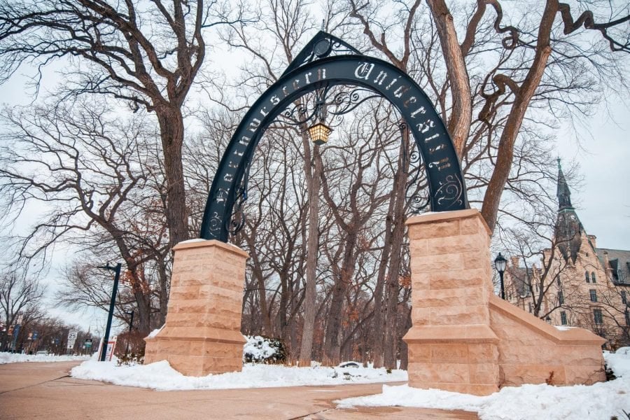 The Weber Arch, which reads Northwestern University, covered in snow.