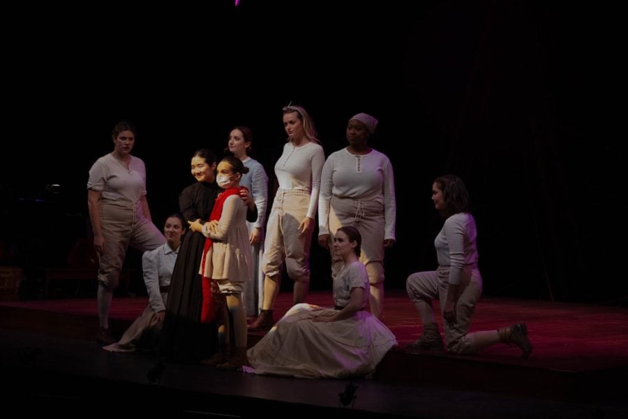 Clara Prime, played by Communication senior Claire Kwon, and young Clara, played by 11-year-old actor Bella Ouellette are surrounded by the rest of the characters.