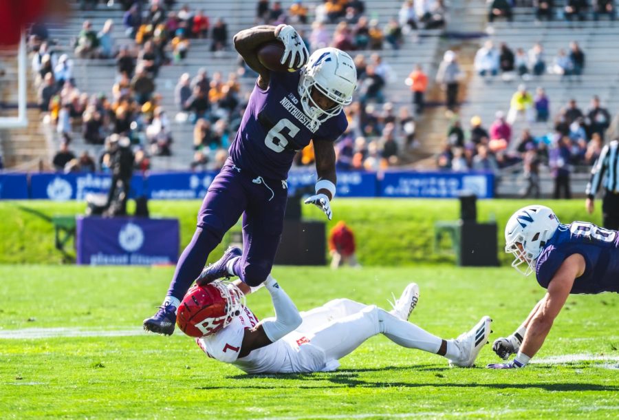 Malik Washington evades a Rutgers defender. The junior wide receiver caught five passes for 84 yards and a touchdown Saturday.