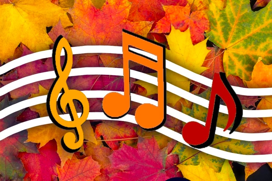 Three orange and red musical notes float against a background of colorful fall leaves.