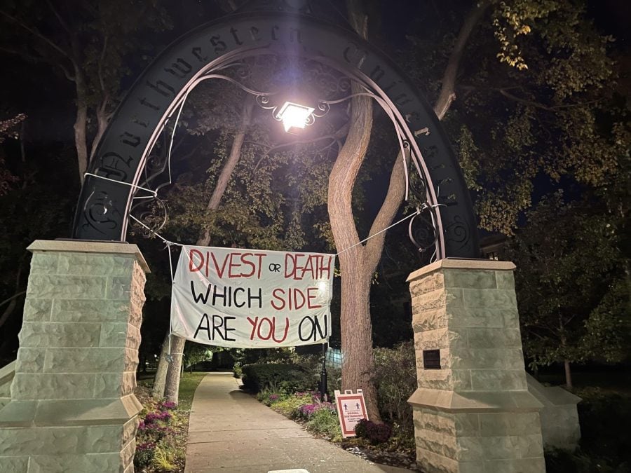 A white banner hung across The Arch with the words “DIVEST or DEATH: WHICH SIDE ARE YOU ON?”