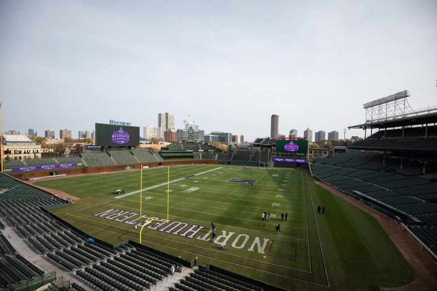 A football field inside of a baseball stadium, with the text “Northwestern” and “Wildcats” in each end zone and a purple “N” in the center.